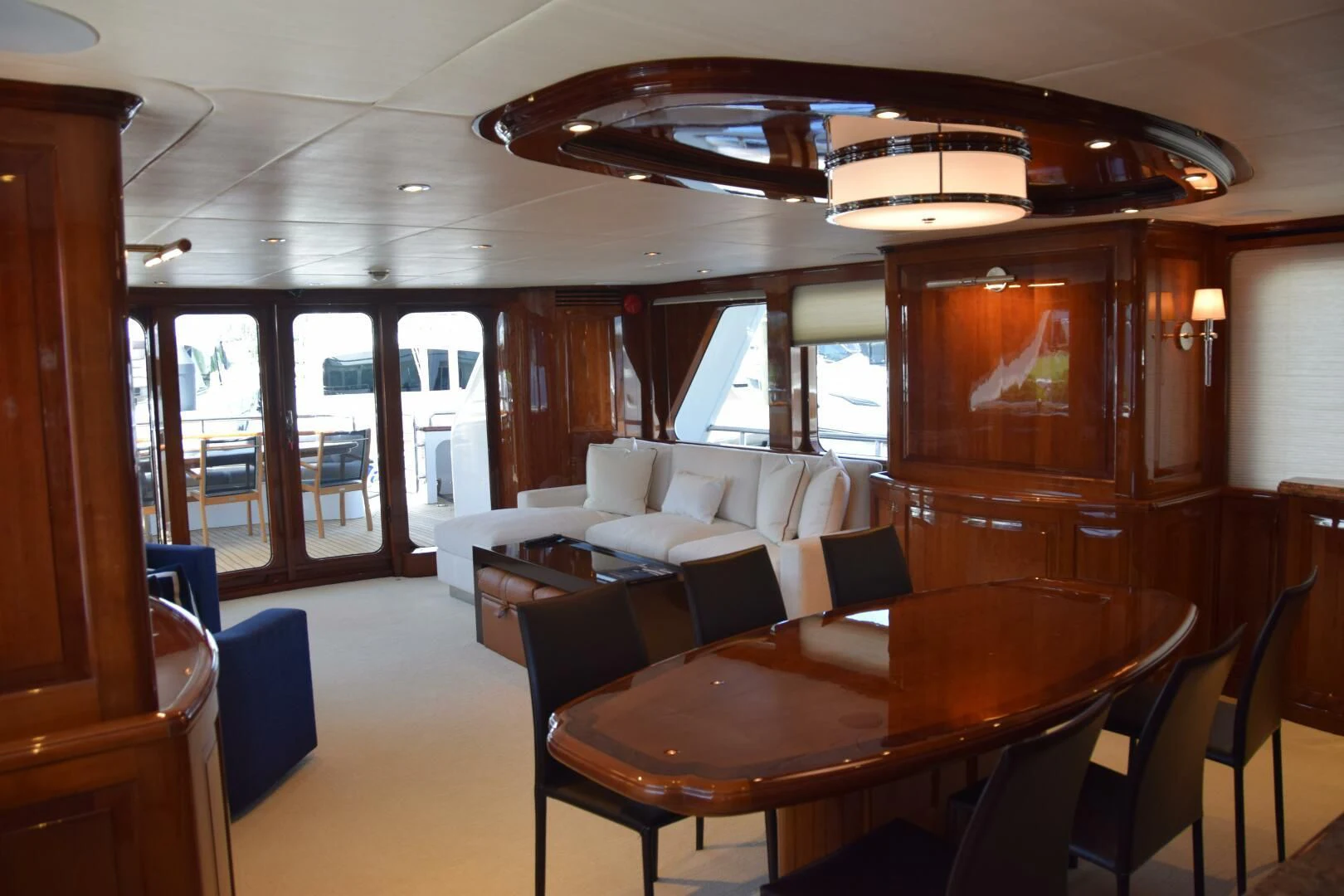a room with a table and chairs aboard DRIVEN Yacht for Sale