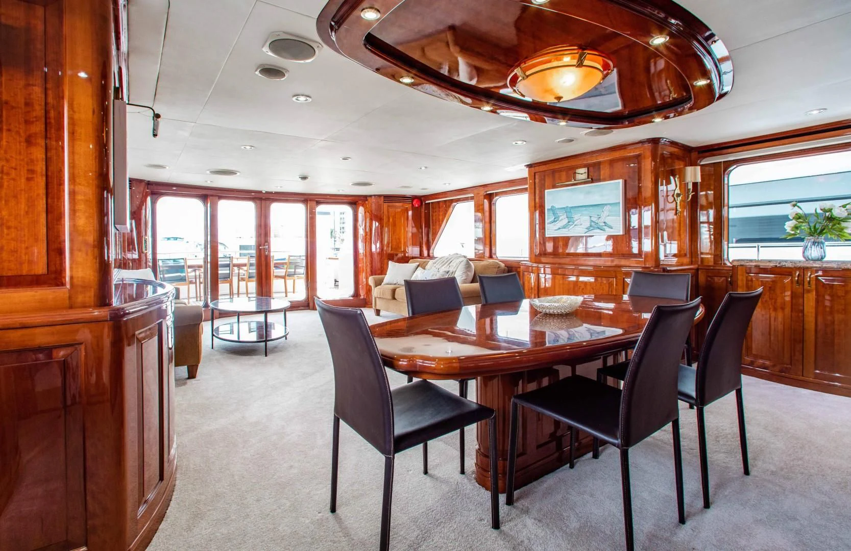 a large dining room with a table and chairs aboard DRIVEN Yacht for Sale