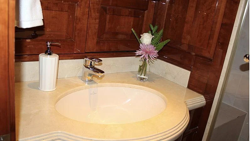 a sink with a flower in it aboard DRIVEN Yacht for Sale
