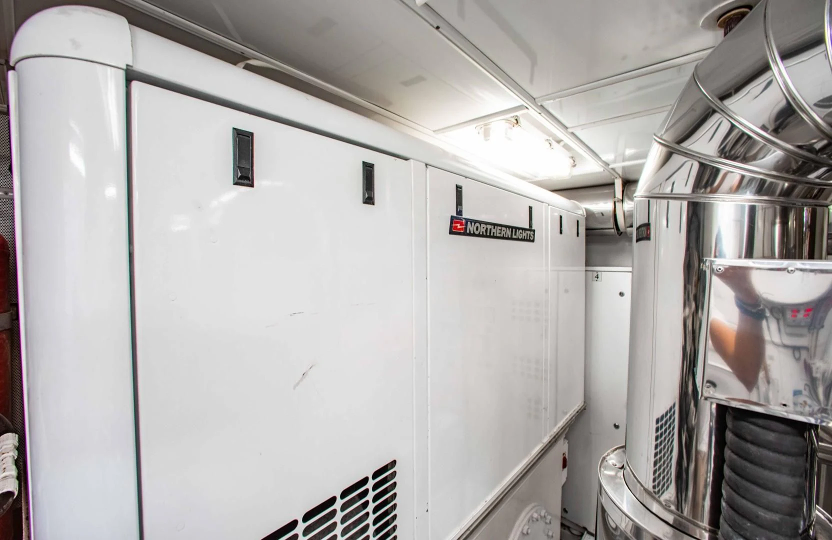 a large white machine aboard DRIVEN Yacht for Sale