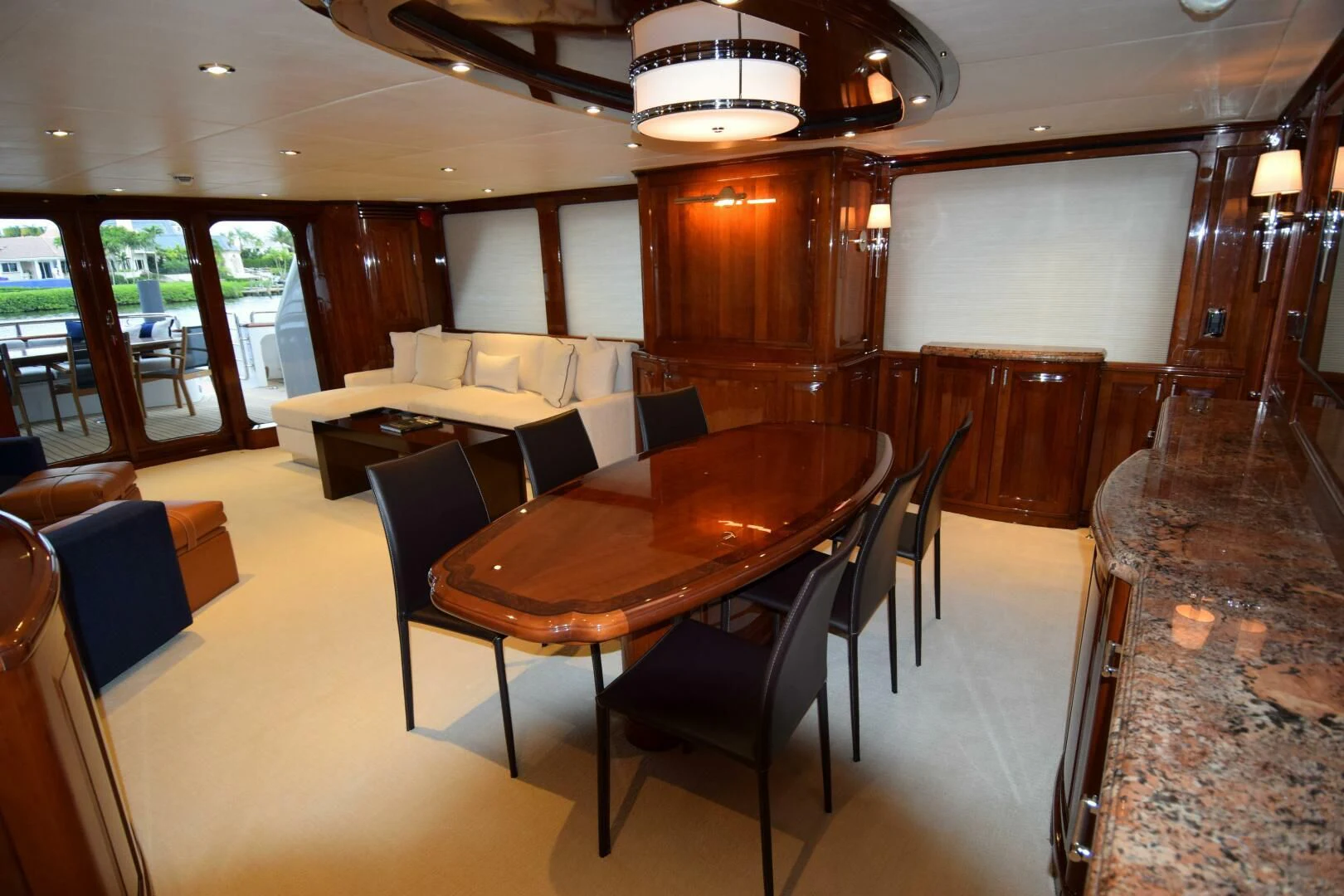 a large room with tables and chairs aboard DRIVEN Yacht for Sale