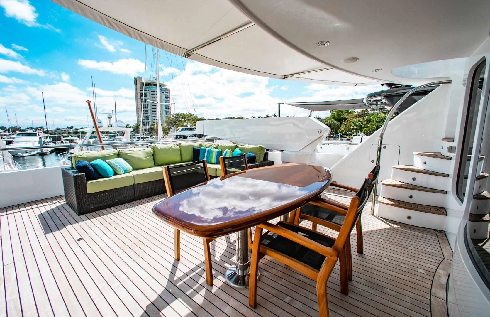a table and chairs on a deck aboard DRIVEN Yacht for Sale
