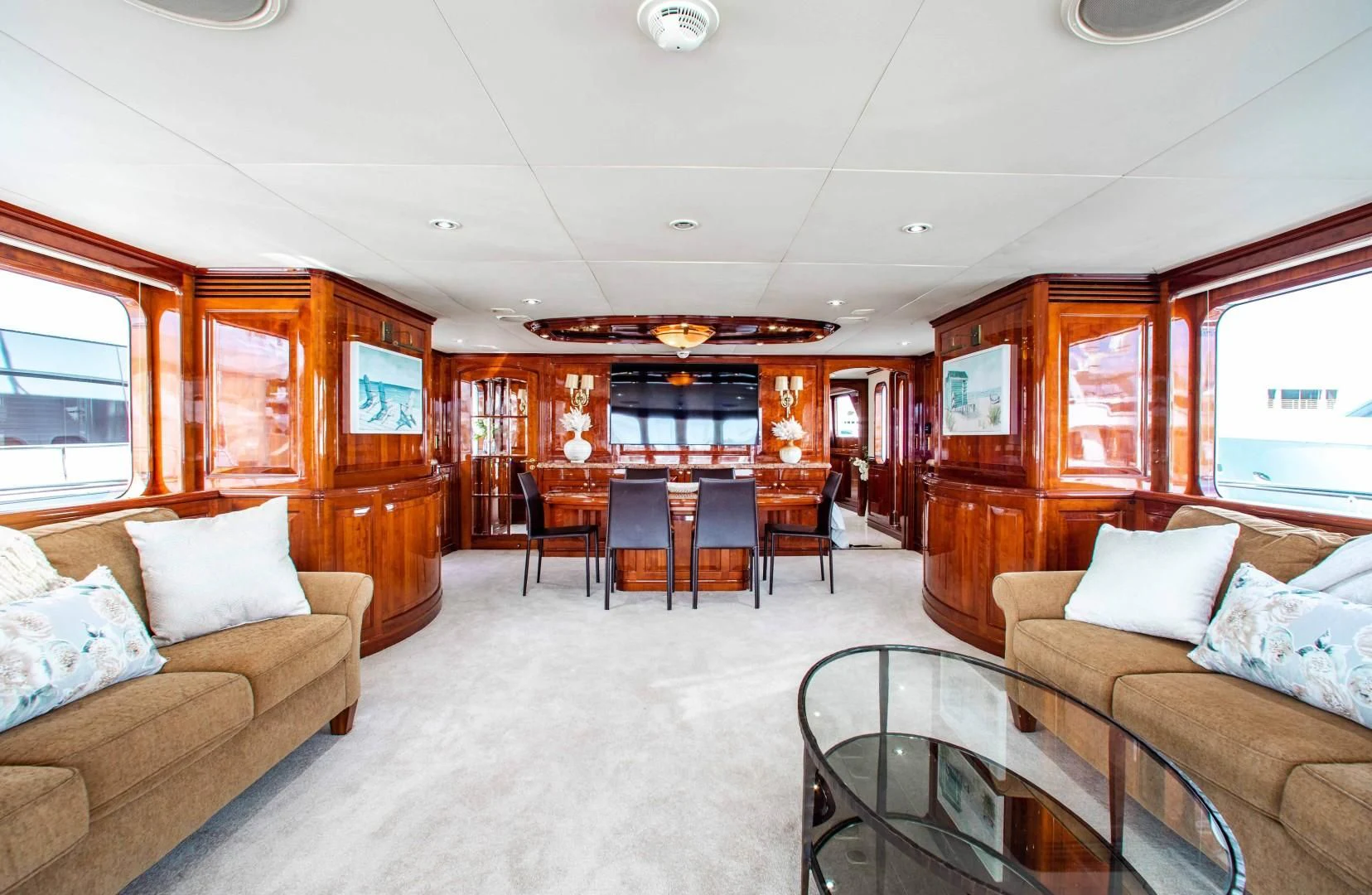 a living room with a couch and a table aboard DRIVEN Yacht for Sale