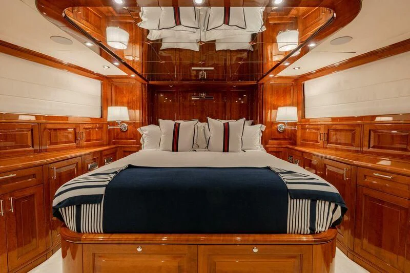 a large bed in a room aboard DRIVEN Yacht for Sale