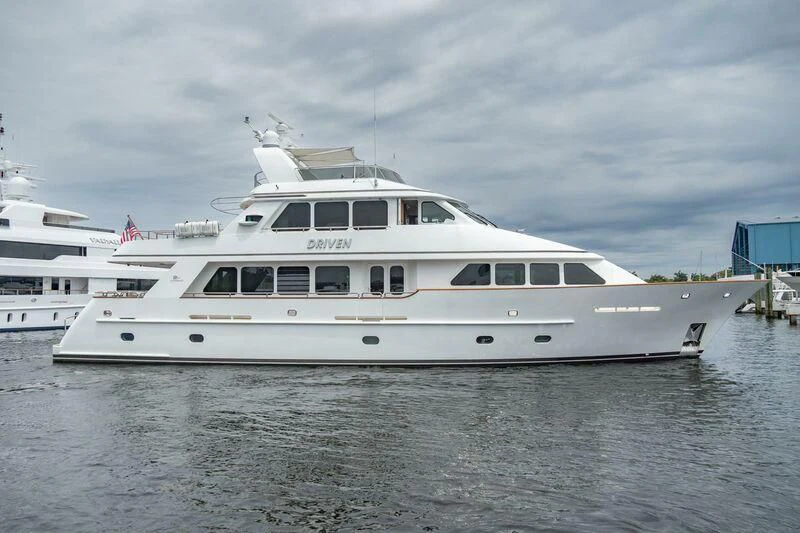 a white yacht in the water aboard DRIVEN Yacht for Sale