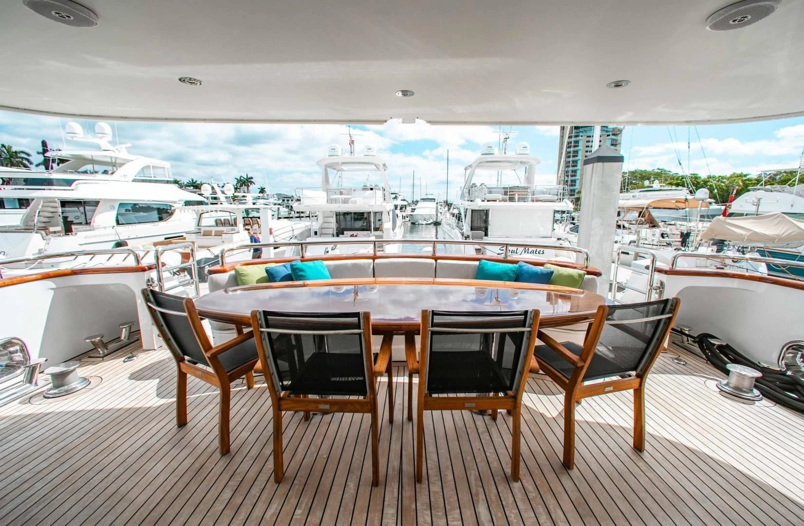 a table and chairs on a deck aboard DRIVEN Yacht for Sale