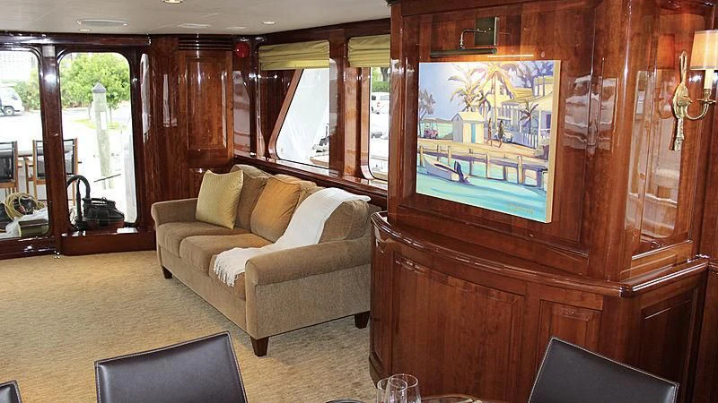 a living room with a large mirror aboard DRIVEN Yacht for Sale