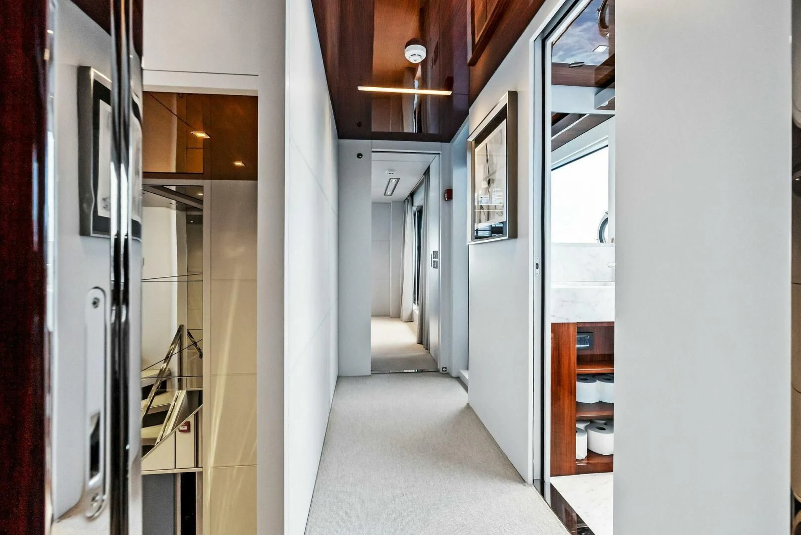 a hallway with white walls aboard NO SURRENDER Yacht for Sale