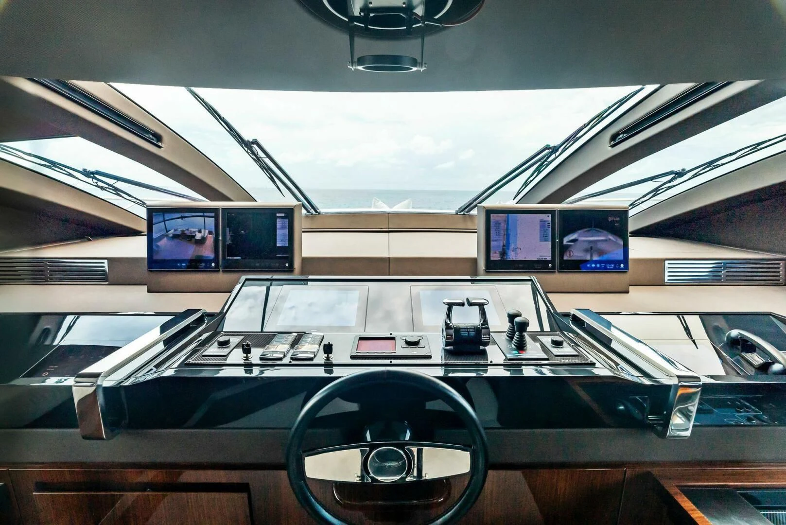 a row of computers on a table aboard NO SURRENDER Yacht for Sale