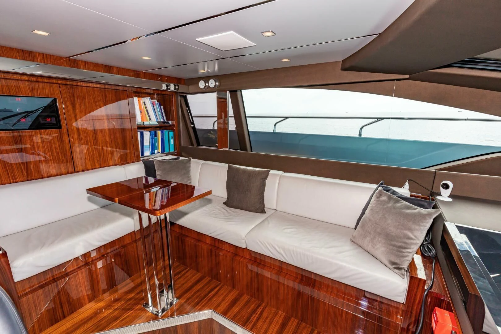 a room with a couch and a table aboard NO SURRENDER Yacht for Sale
