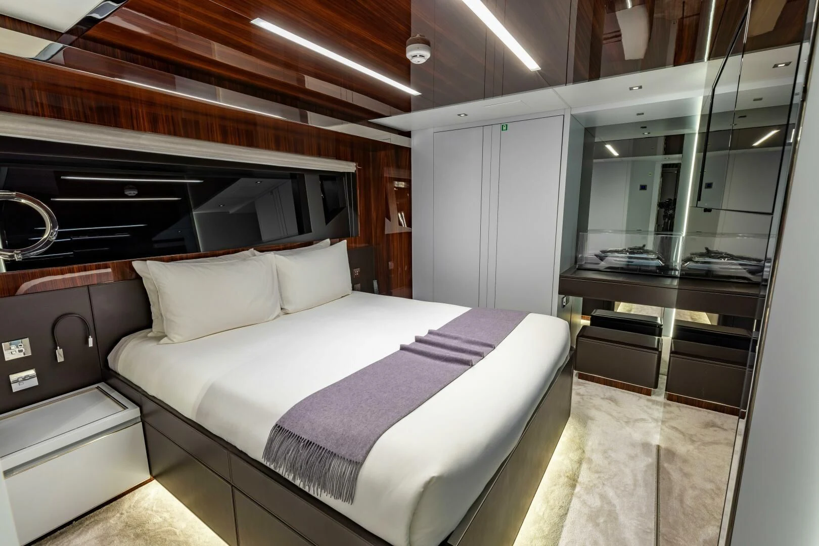 a room with a bed and a desk aboard NO SURRENDER Yacht for Sale
