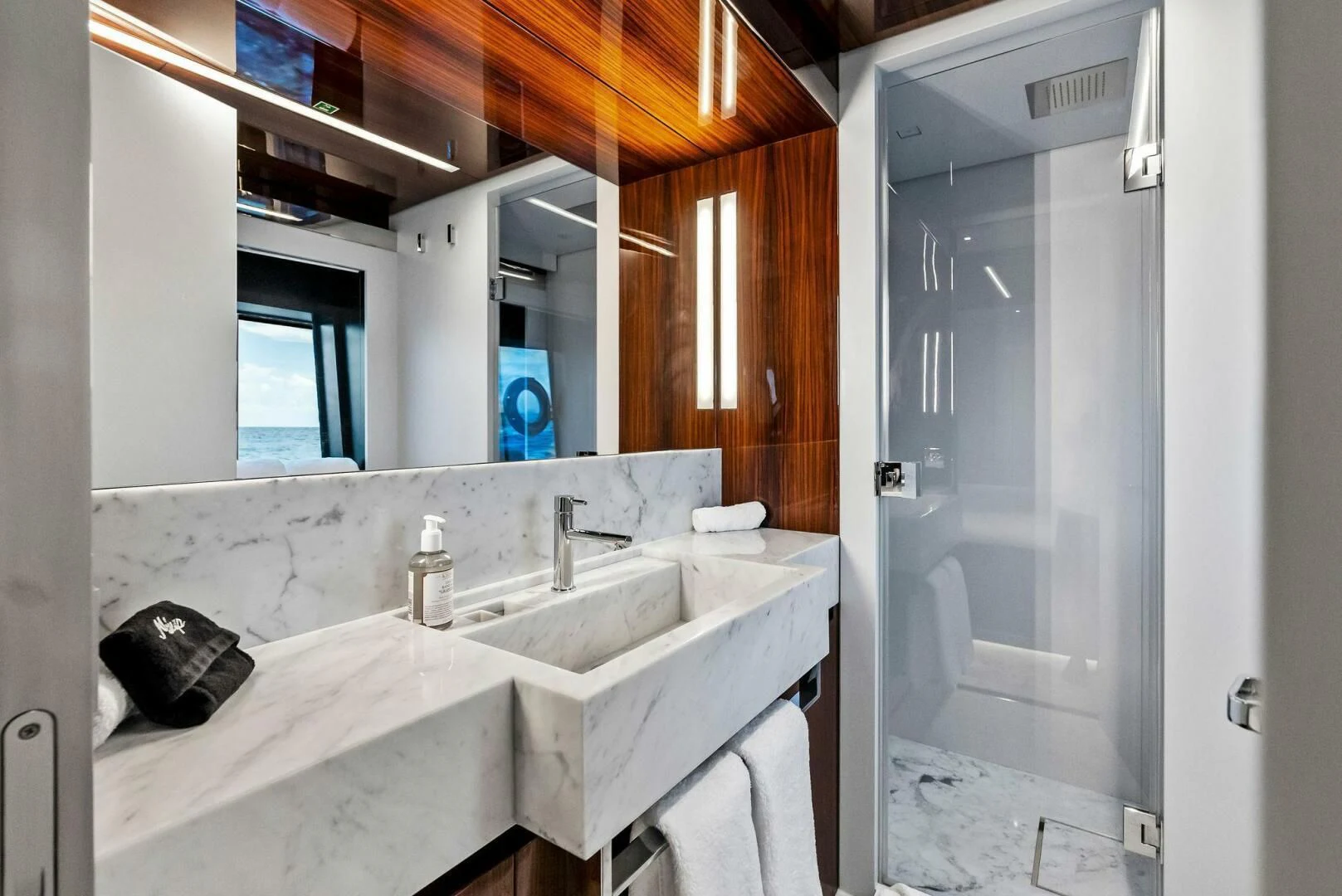 a bathroom with a sink and a mirror aboard NO SURRENDER Yacht for Sale