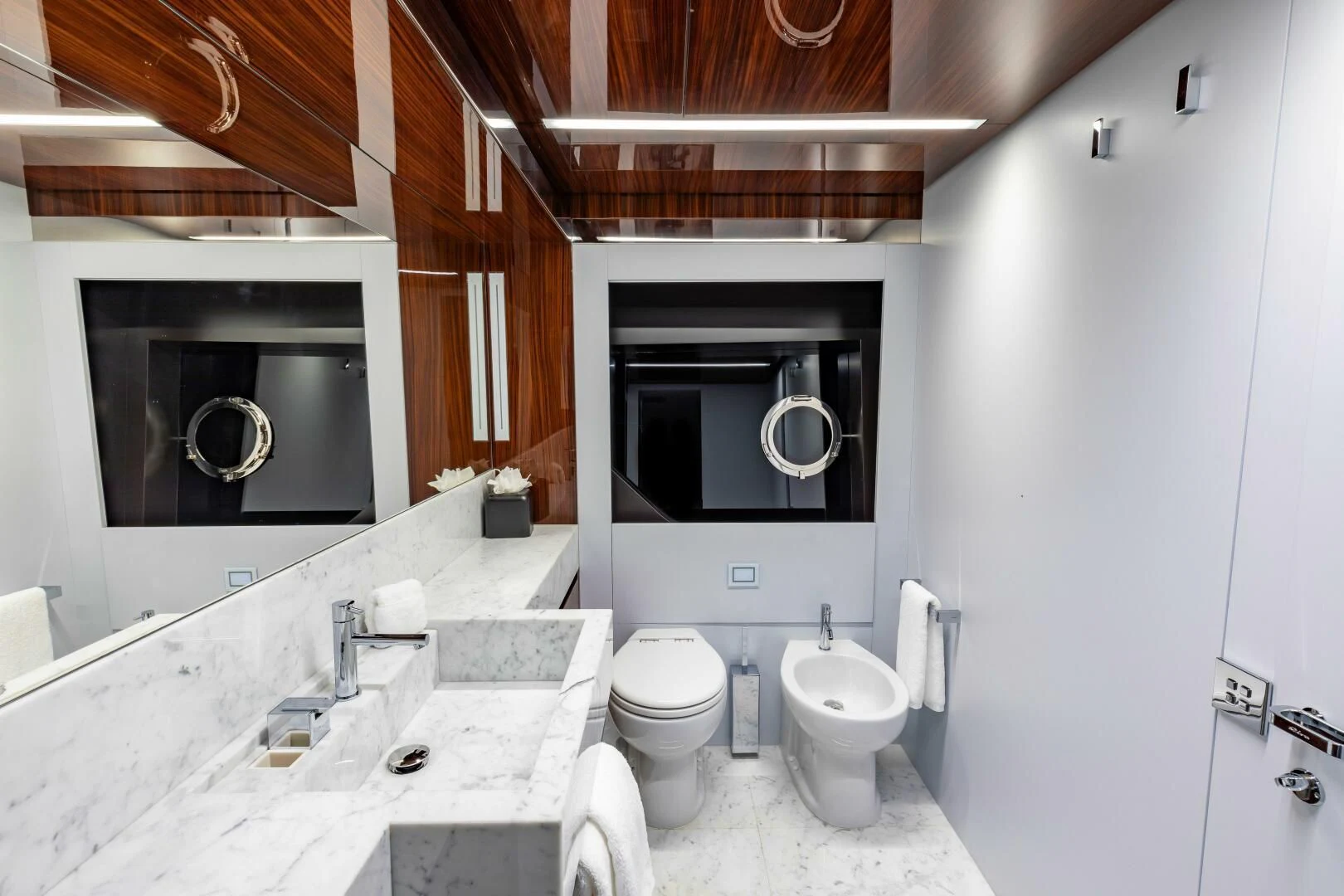 a bathroom with a sink and a toilet aboard NO SURRENDER Yacht for Sale