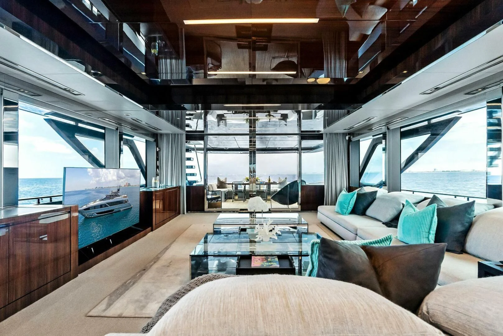 a living room with a large window aboard NO SURRENDER Yacht for Sale