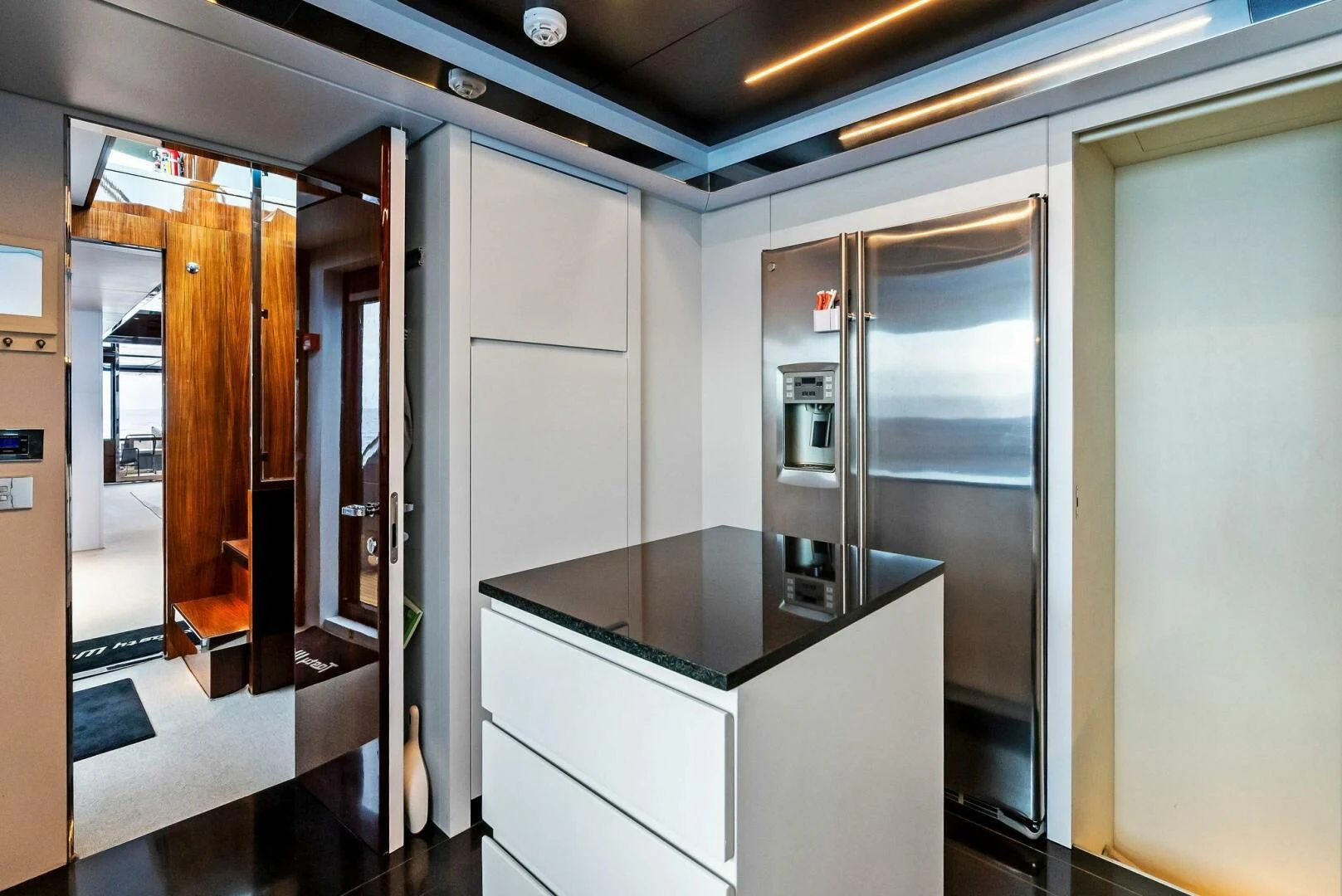 a room with a counter and cabinets aboard NO SURRENDER Yacht for Sale