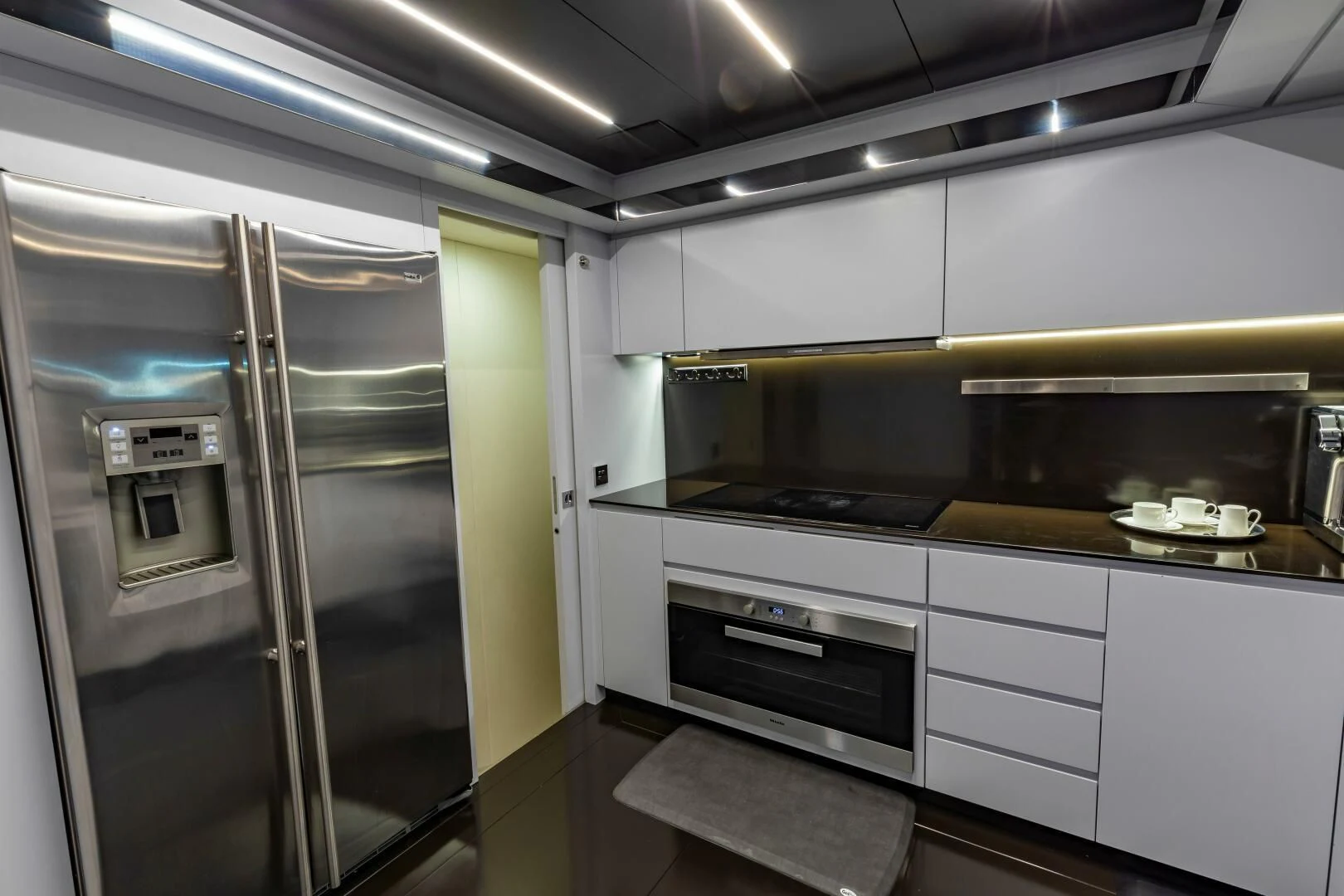 a kitchen with a stove and oven aboard NO SURRENDER Yacht for Sale