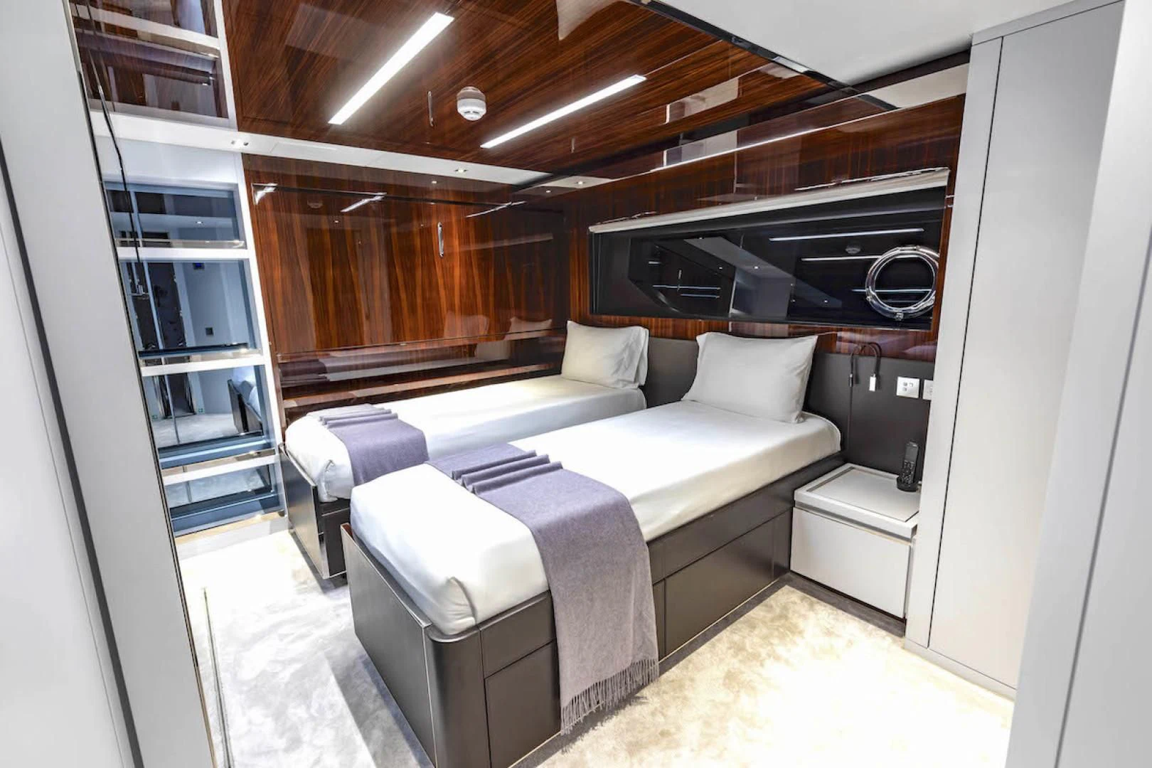 a room with a bed and a tv aboard NO SURRENDER Yacht for Sale