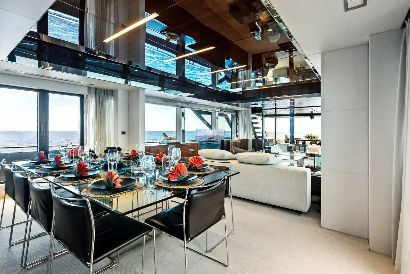a room with a table and chairs aboard NO SURRENDER Yacht for Sale