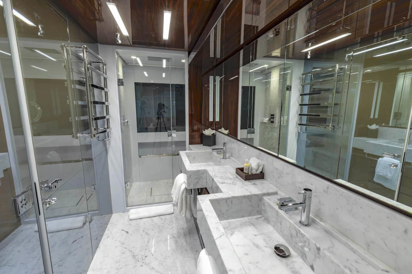a bathroom with a large mirror aboard NO SURRENDER Yacht for Sale