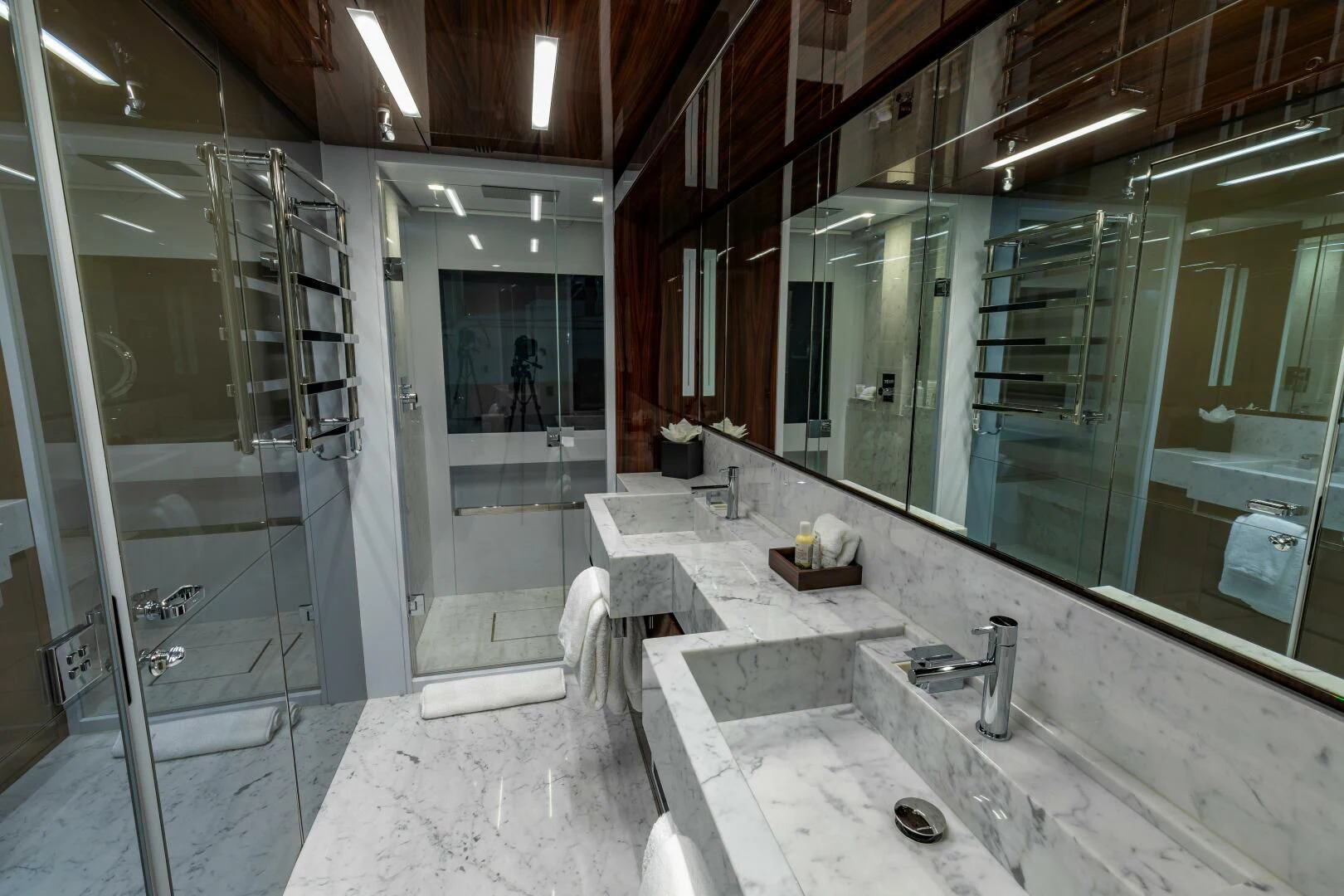 a bathroom with sinks and mirrors aboard NO SURRENDER Yacht for Sale