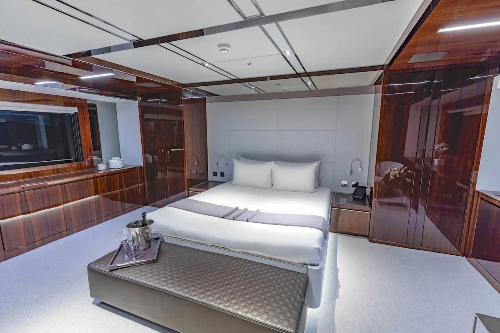 a room with a bed and a television aboard NO SURRENDER Yacht for Sale