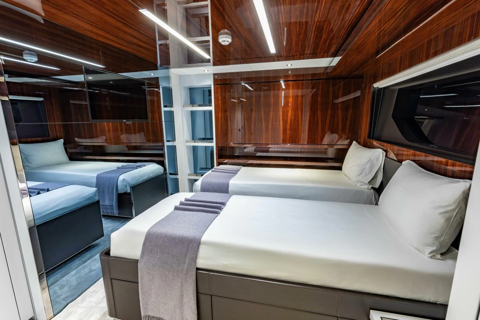 a room with a bed and a couch aboard NO SURRENDER Yacht for Sale