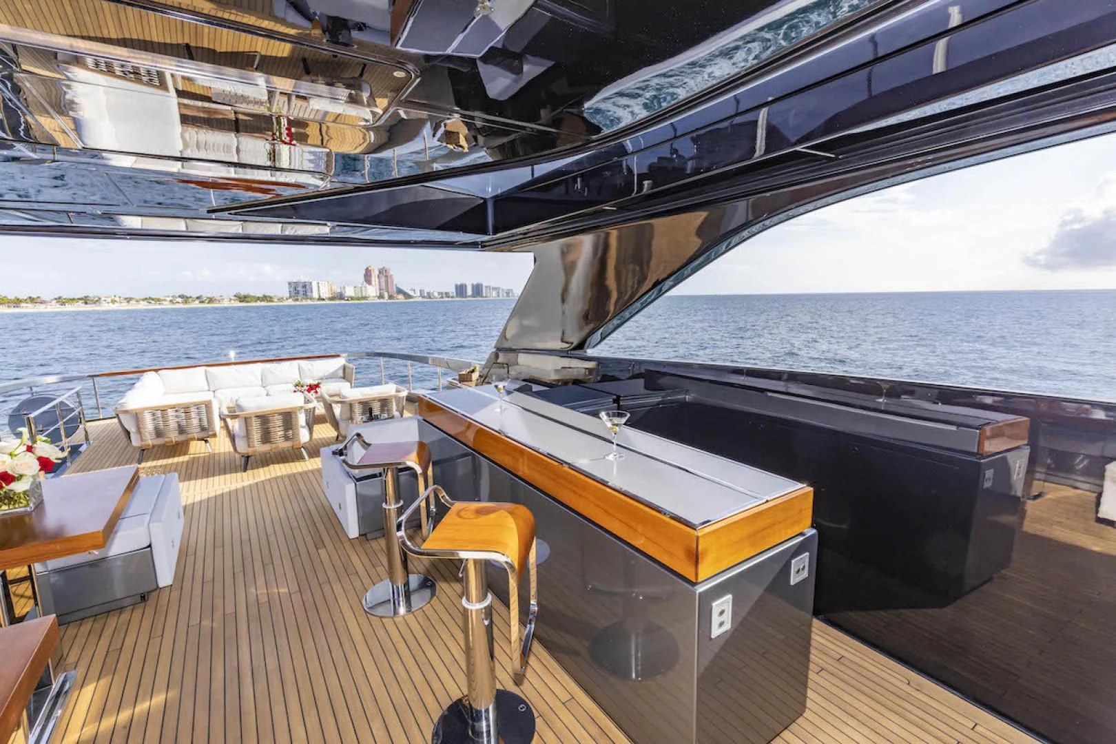 a boat dock with tables and chairs aboard NO SURRENDER Yacht for Sale