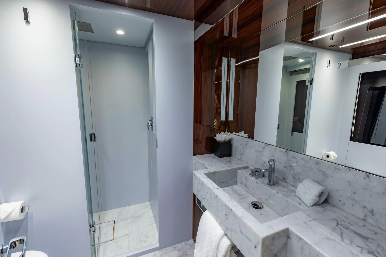 a bathroom with a sink and a mirror aboard NO SURRENDER Yacht for Sale