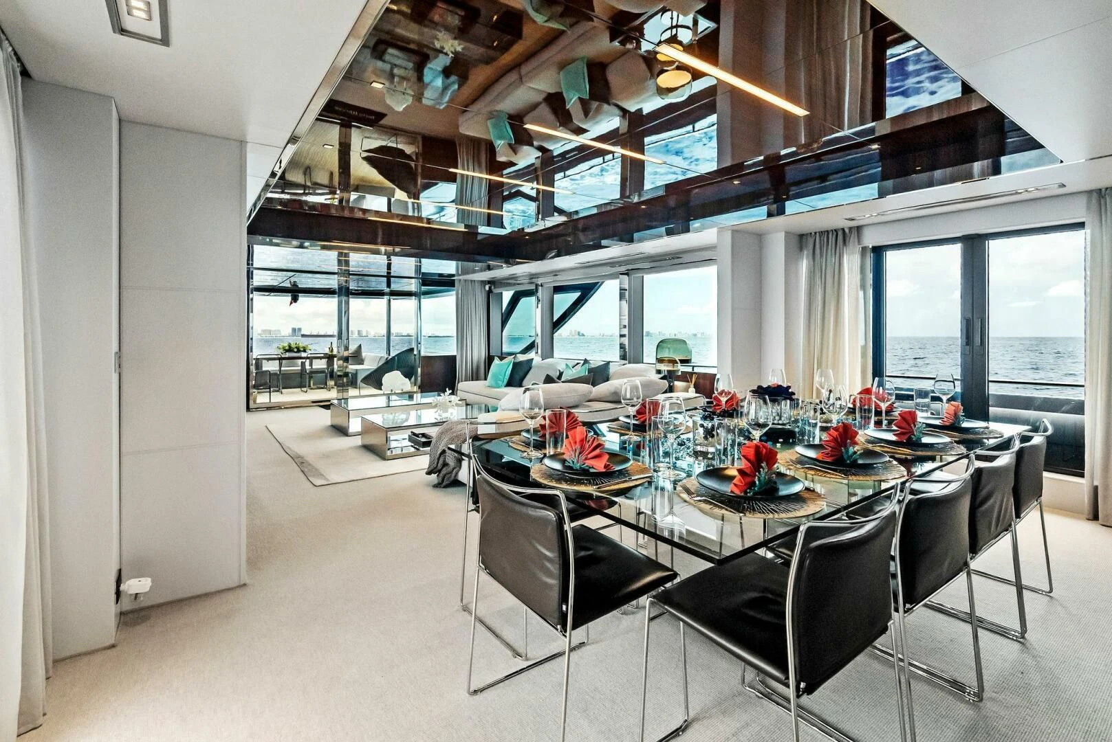 a room with a table and chairs aboard NO SURRENDER Yacht for Sale