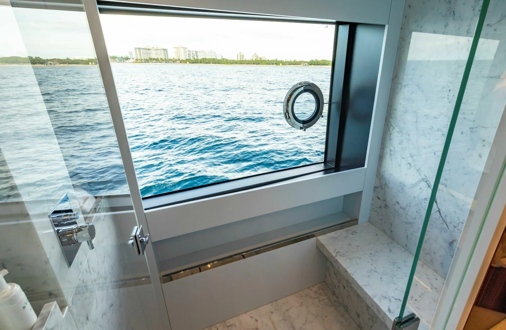a window with a view of the water aboard NO SURRENDER Yacht for Sale