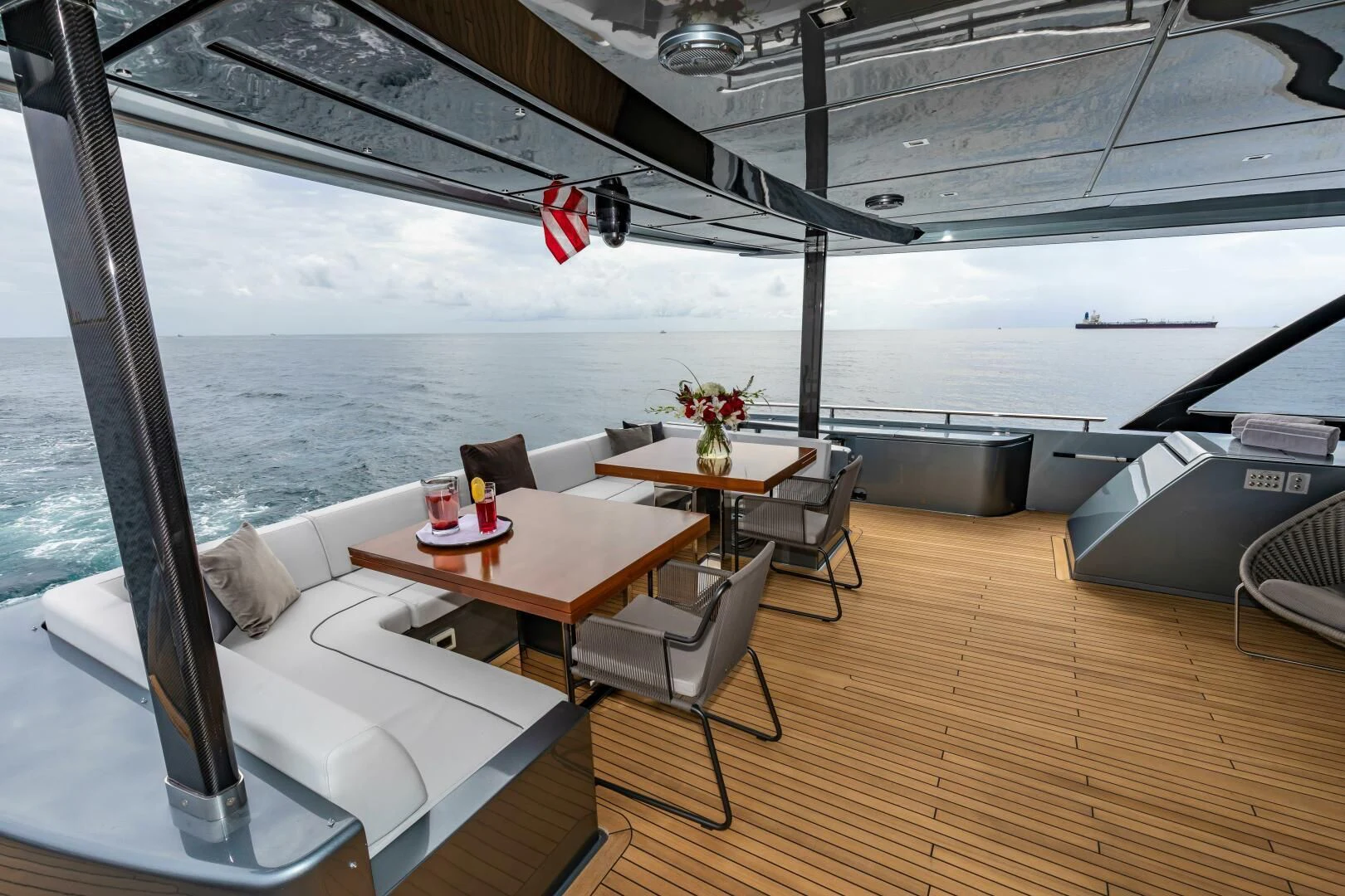 a room with a table and chairs aboard NO SURRENDER Yacht for Sale