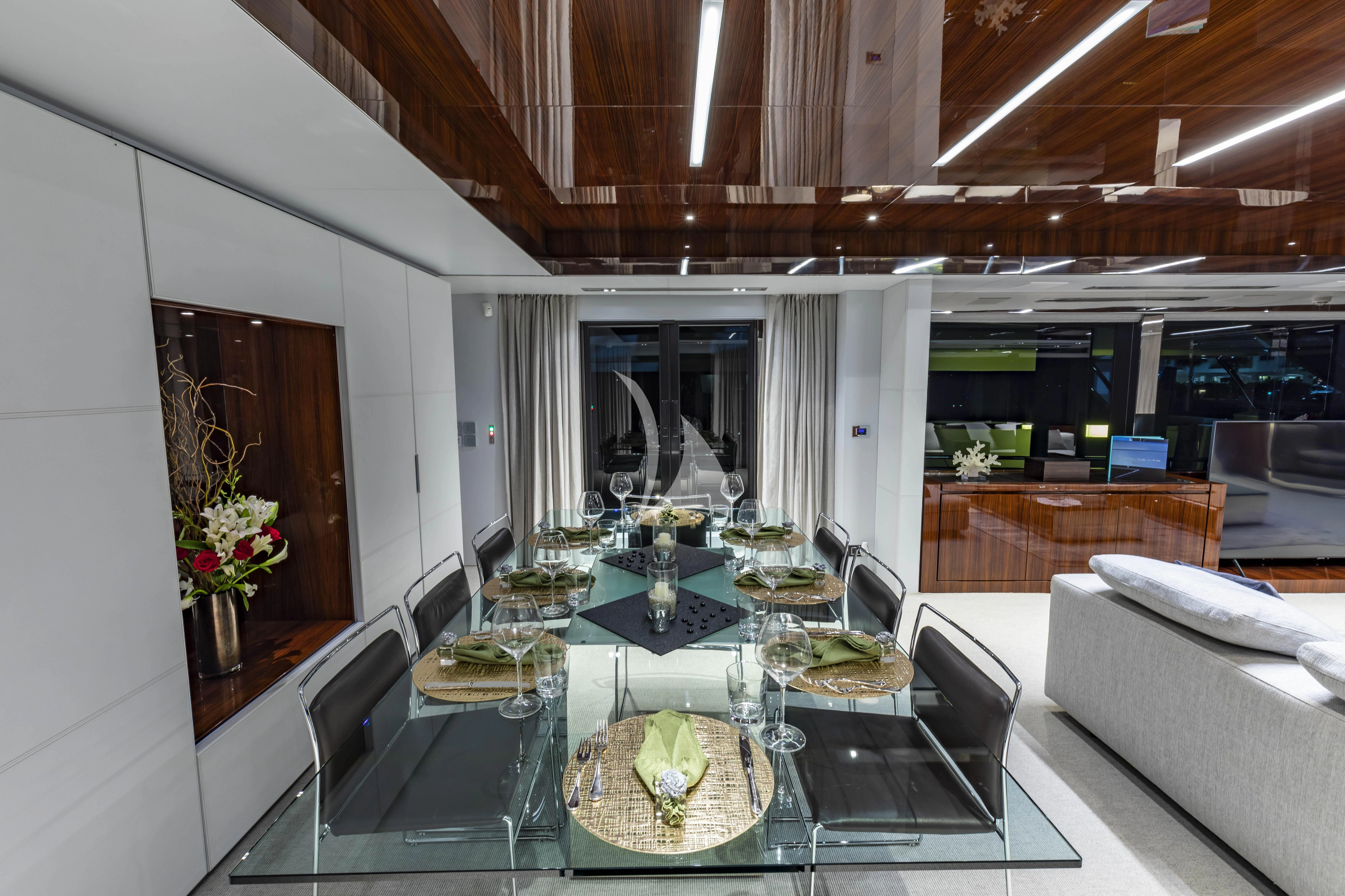 a dining room with a table aboard NO SURRENDER Yacht for Sale