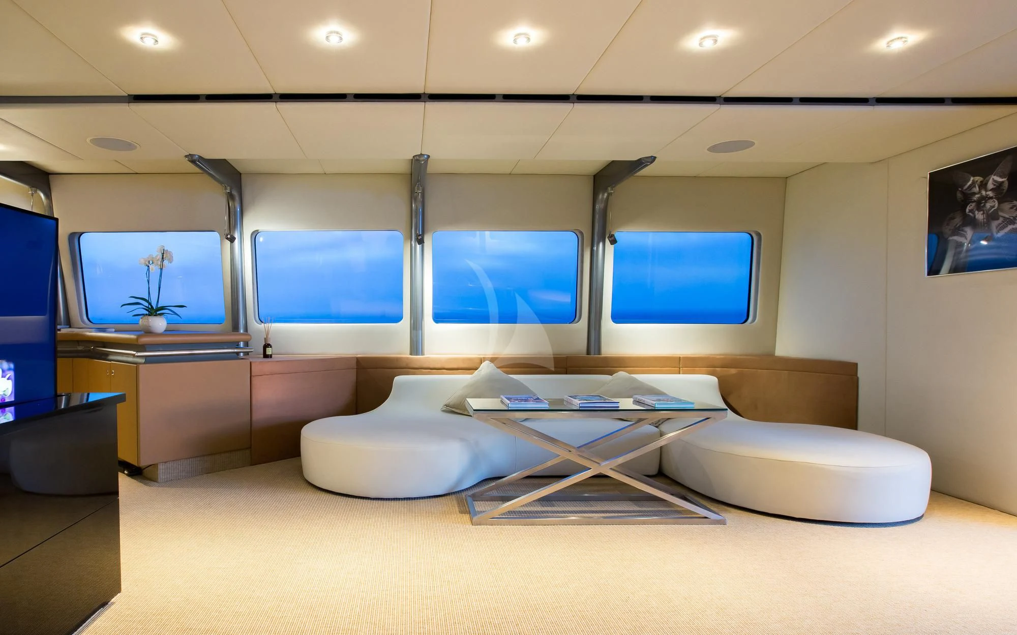a room with a large screen aboard PANDION Yacht for Charter