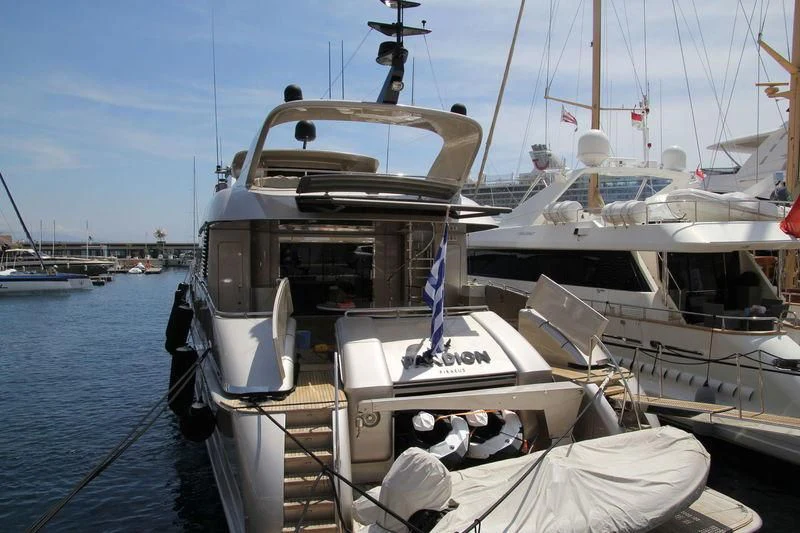 a boat docked at a pier aboard PANDION Yacht for Charter