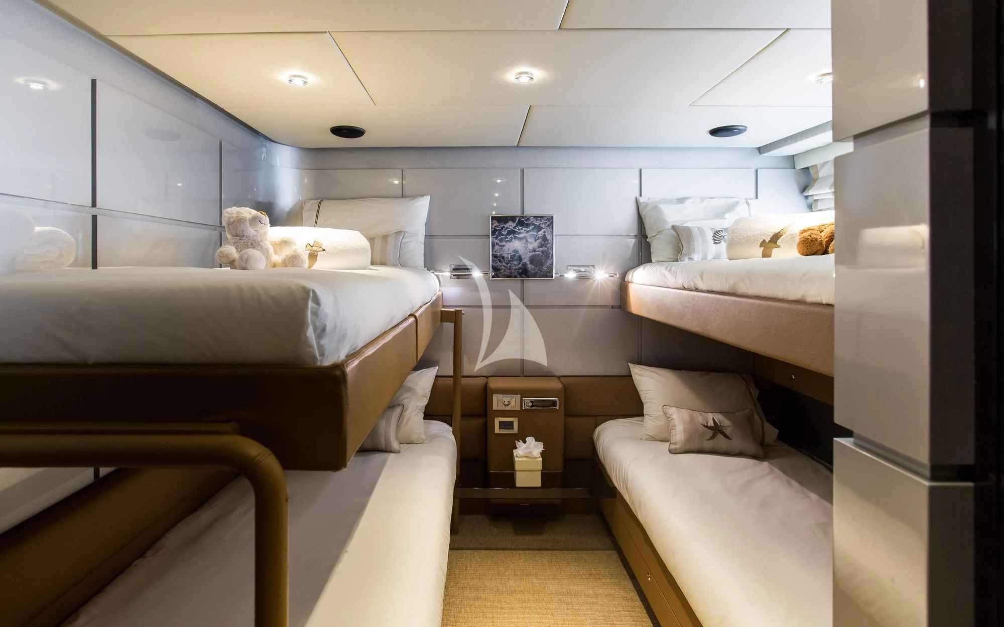 a room with a bed and a desk aboard PANDION Yacht for Charter
