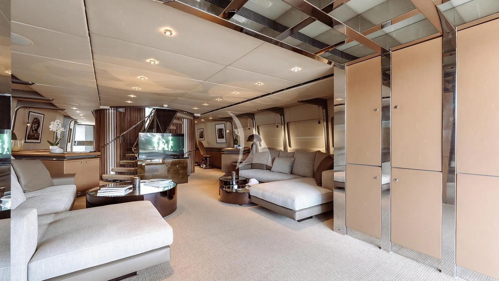 a living room with a large wood cabinet and a television aboard PANDION Yacht for Charter