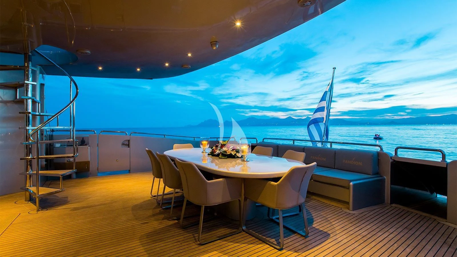 a room with a table and chairs aboard PANDION Yacht for Charter