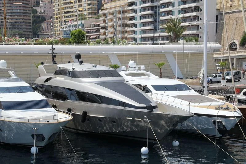several boats parked in a harbor aboard PANDION Yacht for Charter