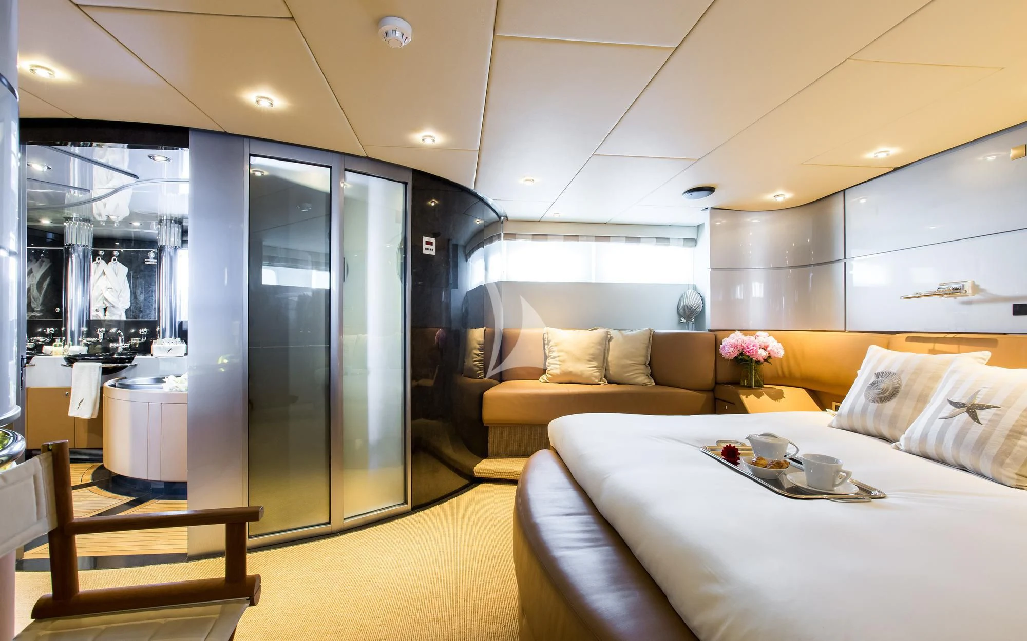 a modern looking bedroom with a large glass door aboard PANDION Yacht for Charter