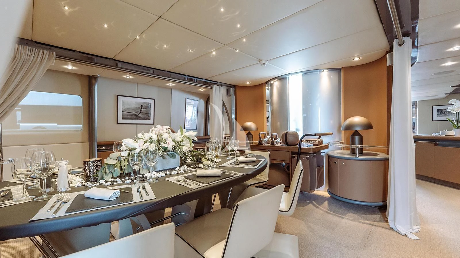 a large room with a table and chairs aboard PANDION Yacht for Charter