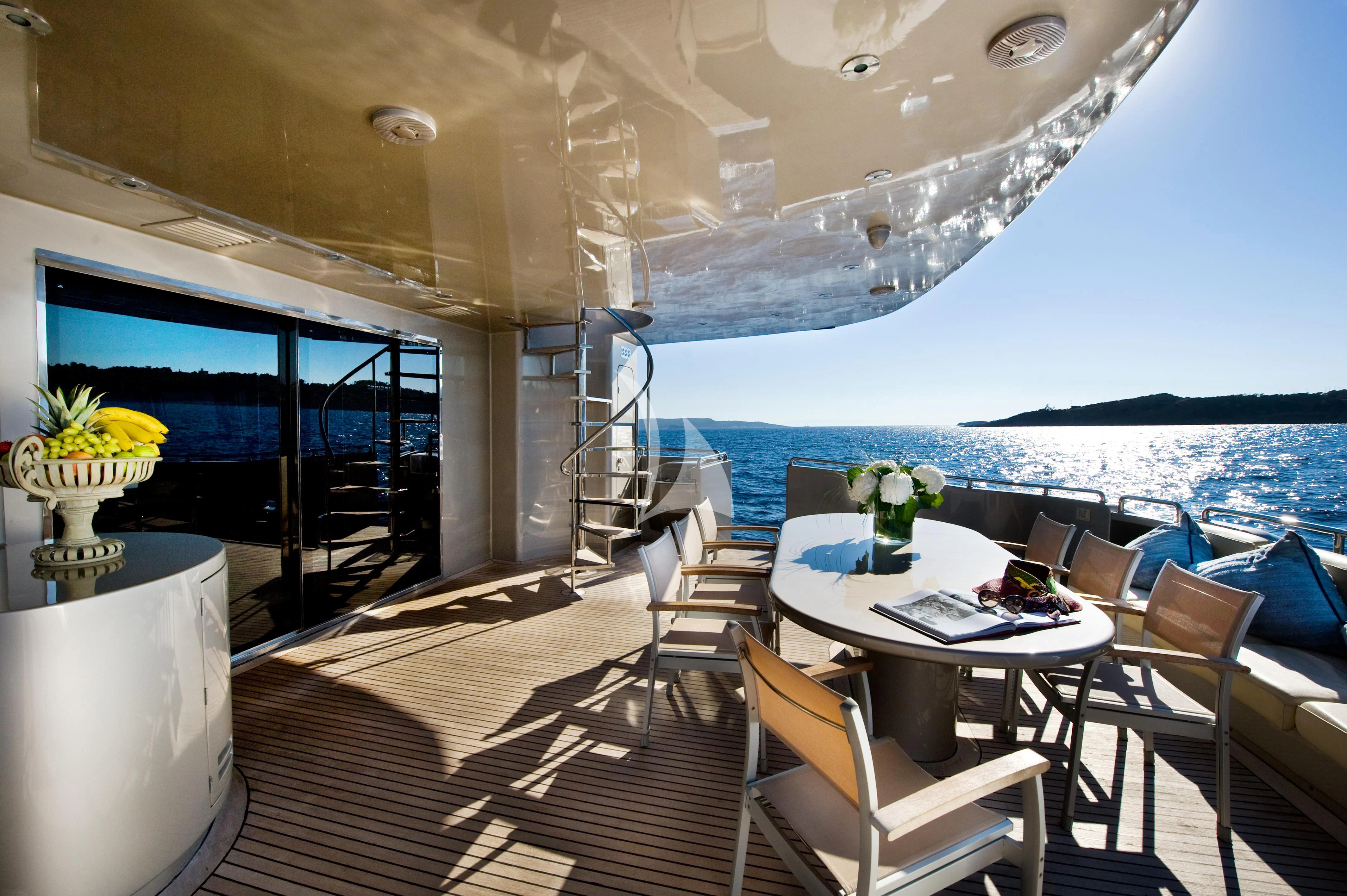 a room with a table and chairs aboard PANDION Yacht for Charter