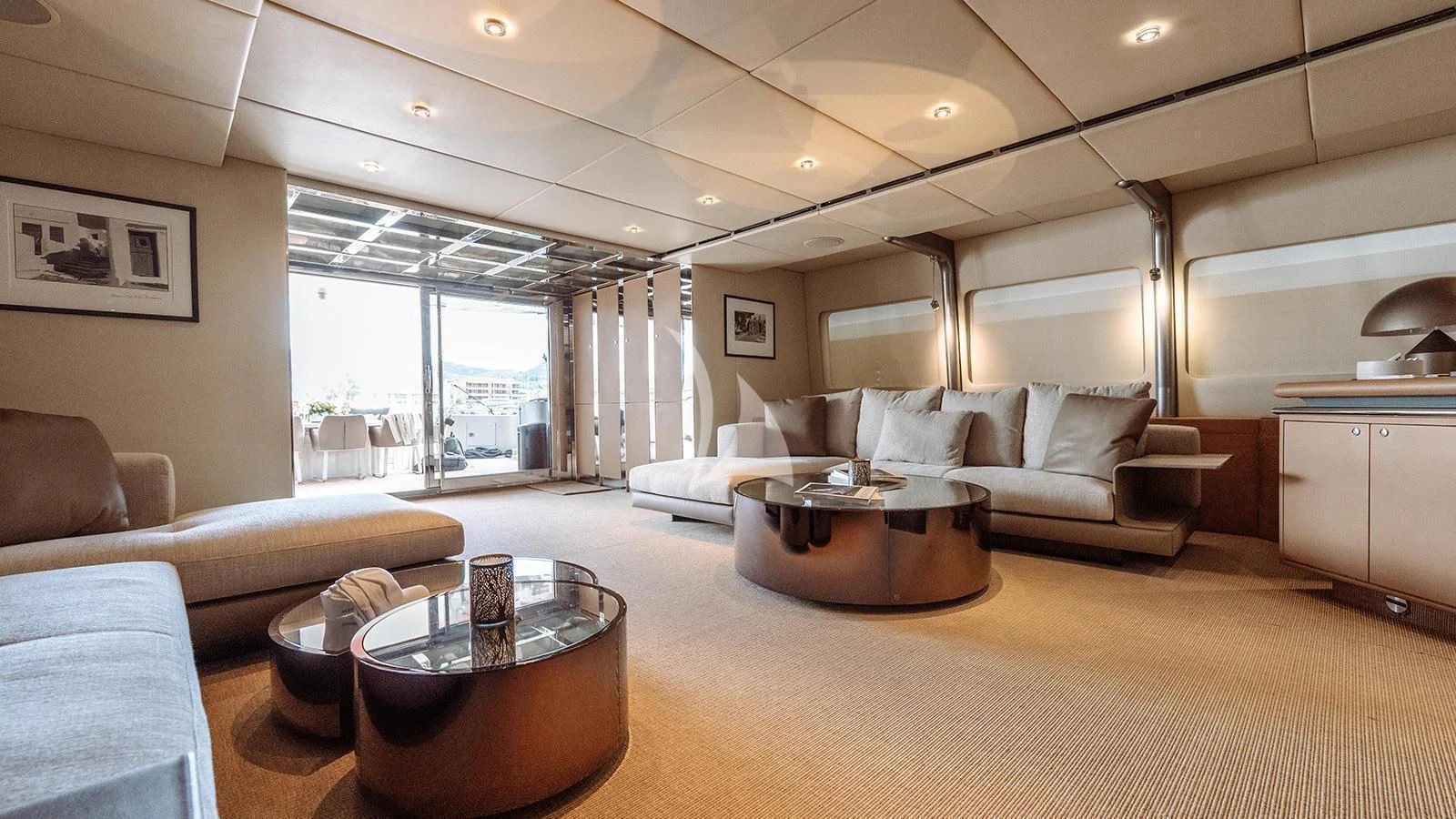 a living room with a large window aboard PANDION Yacht for Charter