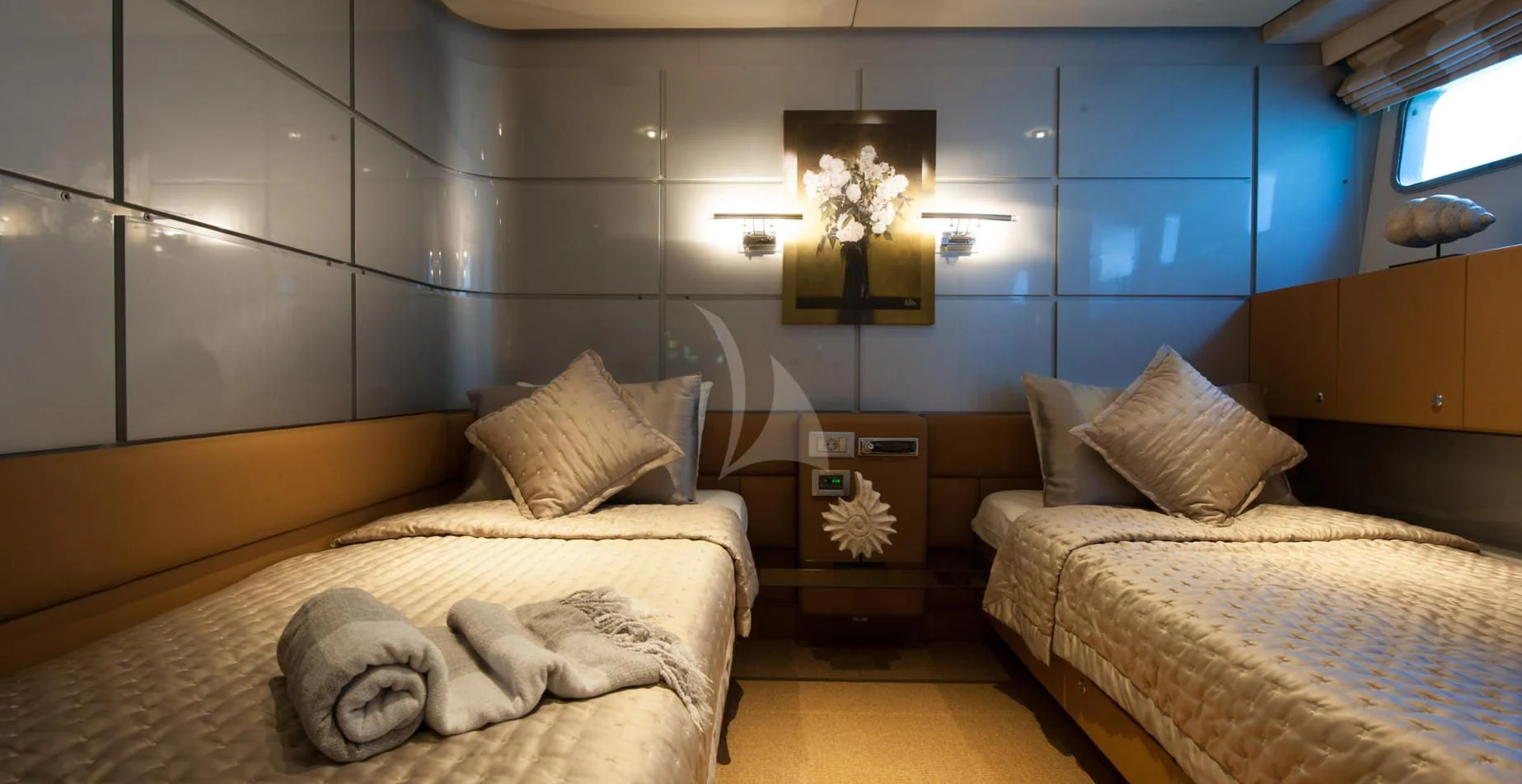 a room with a couple of beds aboard PANDION Yacht for Charter
