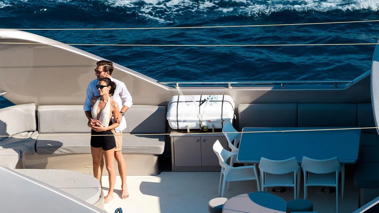 a woman taking a picture of himself on a boat aboard PANDION Yacht for Charter