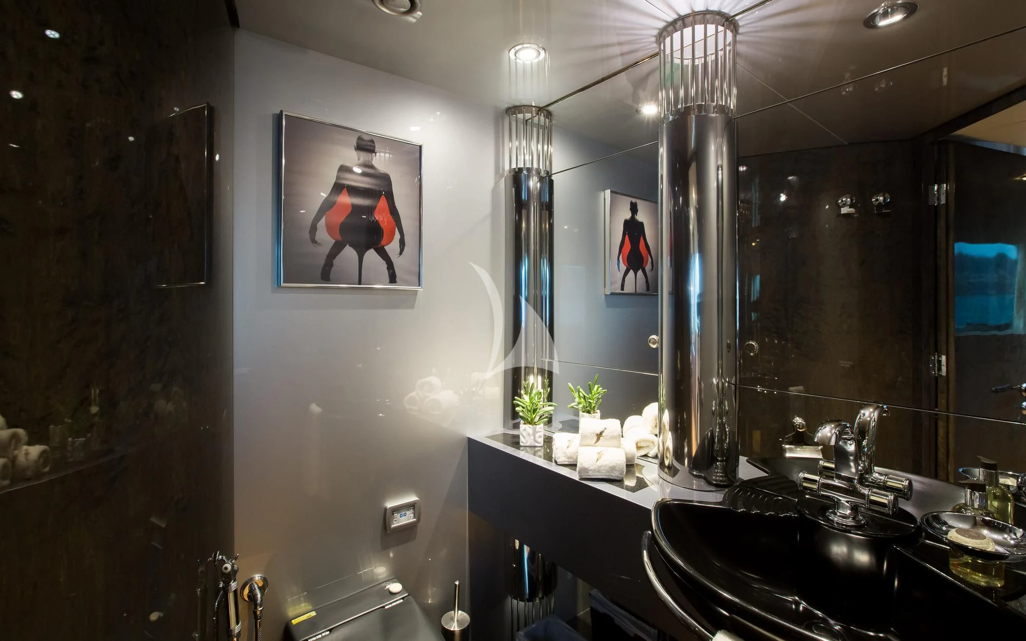 a bathroom with a large mirror aboard PANDION Yacht for Charter