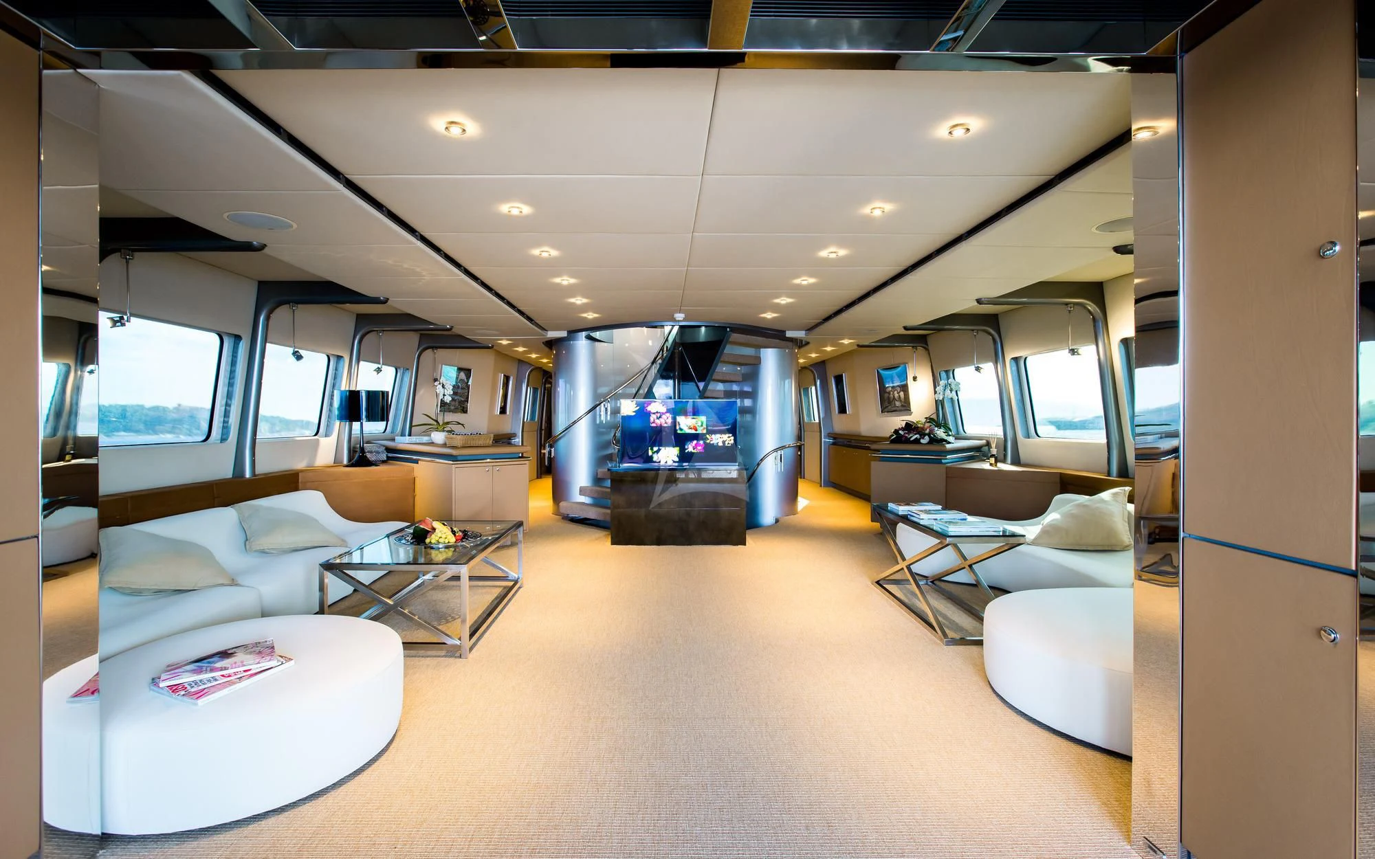 a living room with a large window aboard PANDION Yacht for Charter