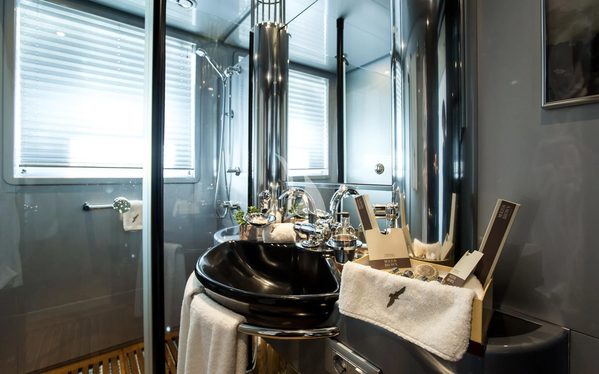 a bathroom with a sink and a mirror aboard PANDION Yacht for Charter