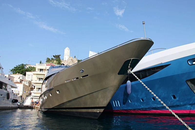 a boat docked in a harbor aboard PANDION Yacht for Charter