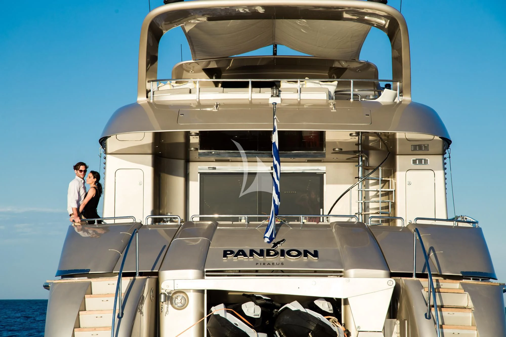 a couple of people on a boat aboard PANDION Yacht for Charter