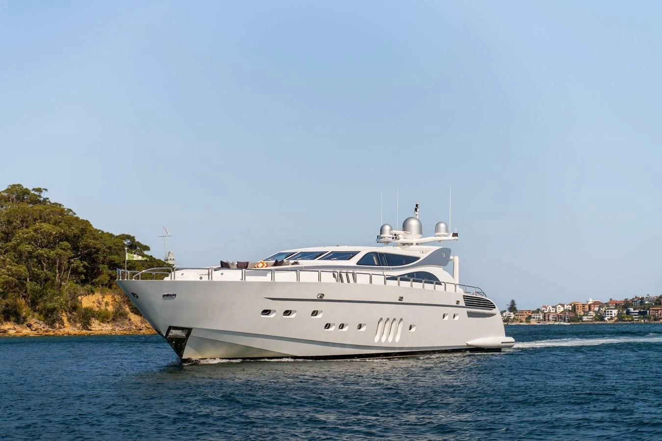 a white yacht on the water aboard YOLO Yacht for Sale